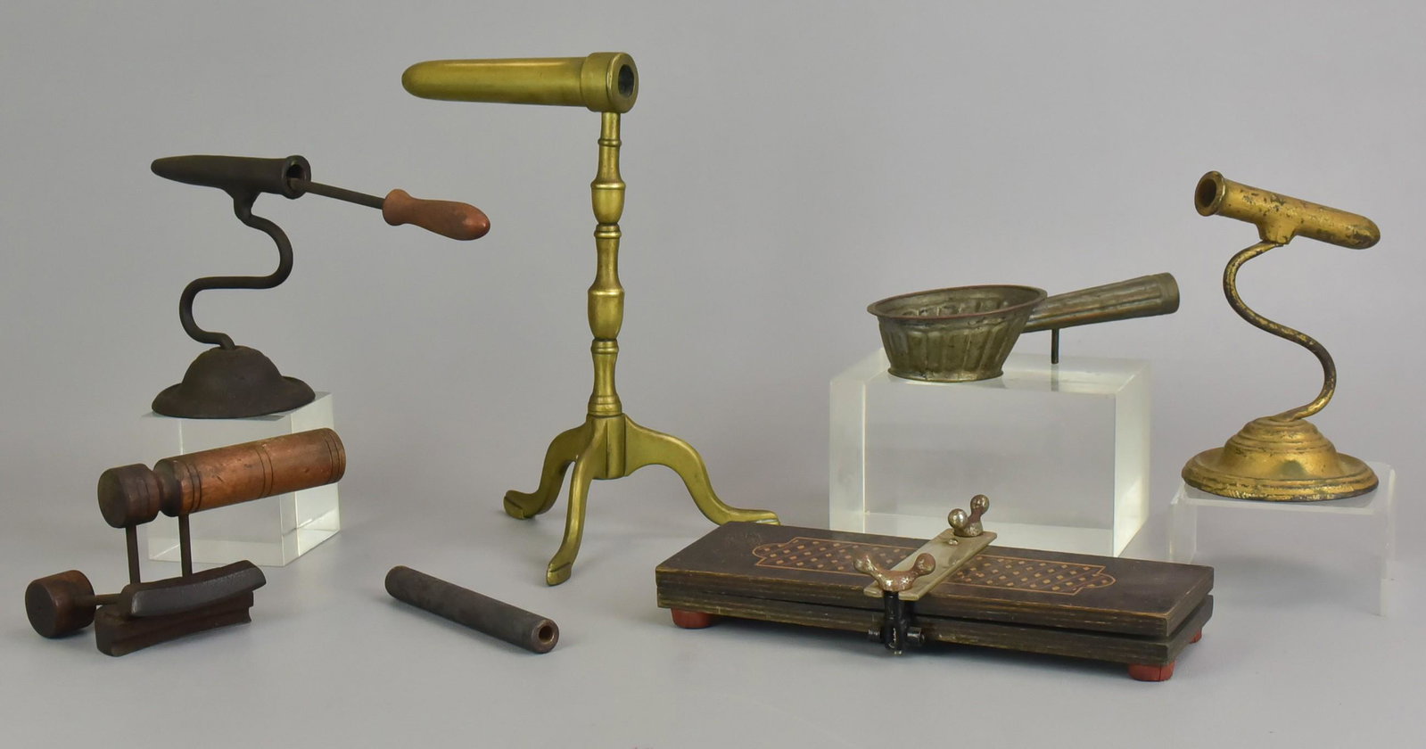 Lot of Ironing Implements: Lot of ironing implements, c/o inlaid wood tie press, brass Queen Anne goffering iron, (2) unmarked goffering irons, hat brim iron, Chinese pan iron