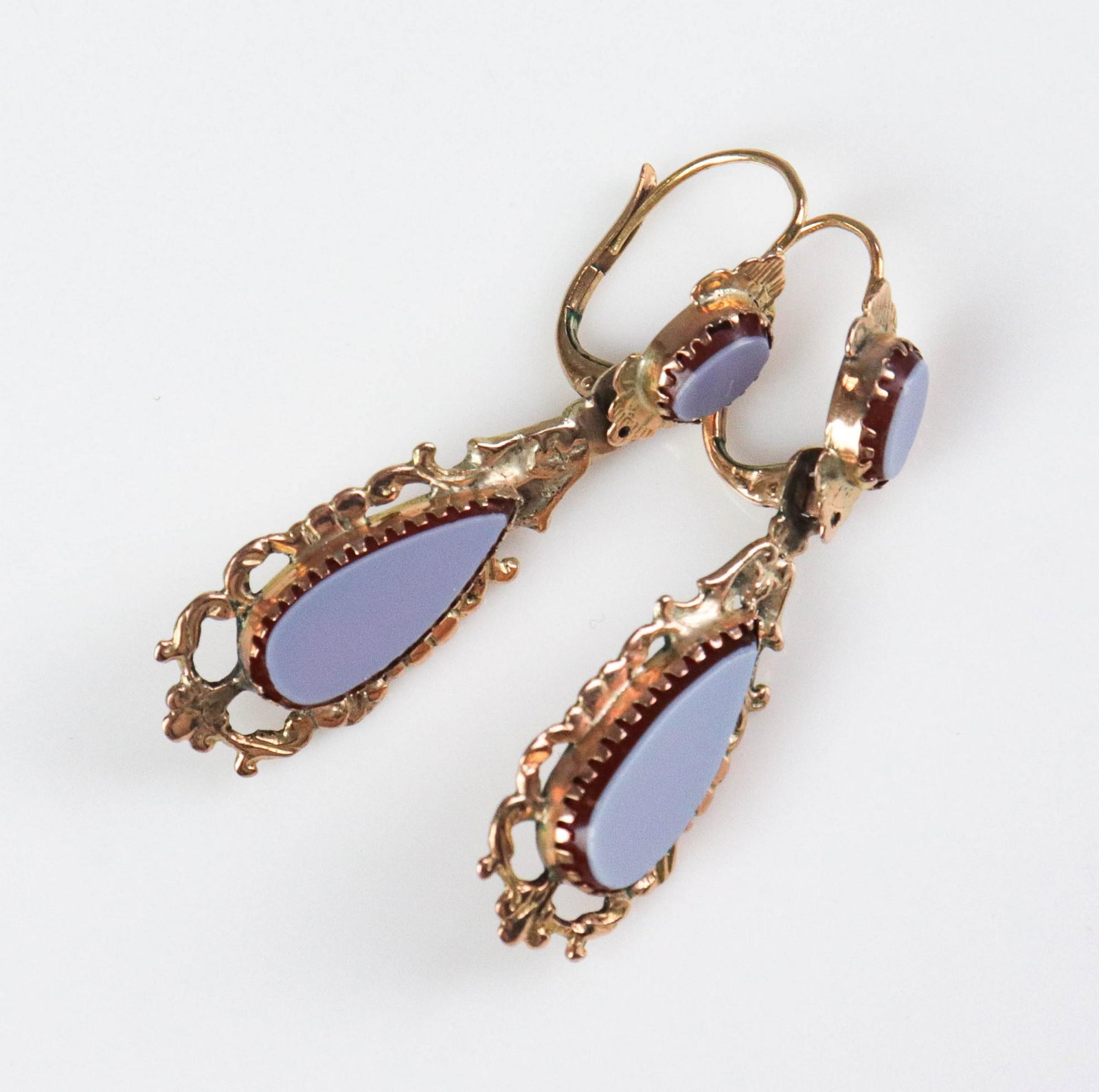 10K Yellow Gold Victorian Drop Earrings: (1) Pair of victorian dangle earrings carnelian 4.3 Dwt.small dings to side of drop stone, both repaired at dangle top, repair to hook loop