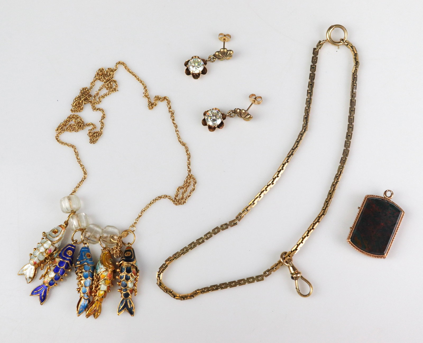 Gold Jewelry Lot: 14K Rope chain with gold plated articulating fish pendants, (1) gold filled pocket watch chain, with a 14K clasp, (1) Vintage GF locket, (1) 14K Yellow gold drop earrings, with white stones 2.7dwt.Som