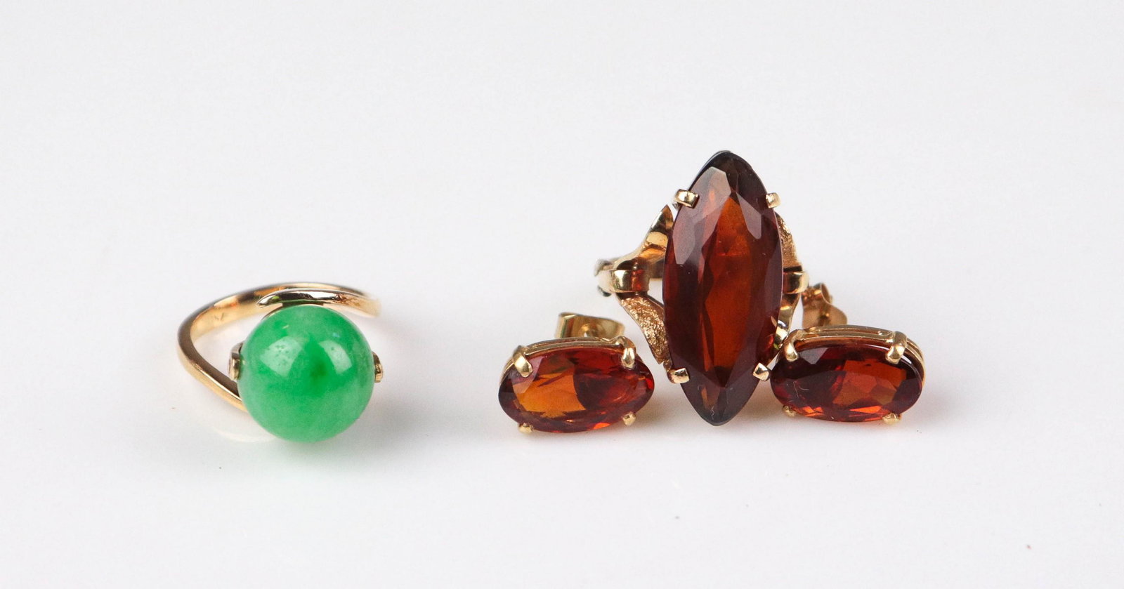 14K and 18K Yellow Gold Jewelry: 18K Yellow gold ring with orange stone, 3.8 dwt(1) 18K Yellow gold ring with green Jade stone, 3.9 dwt(1) 14K Yellow gold earrings, with orange stone, 2.1dwt