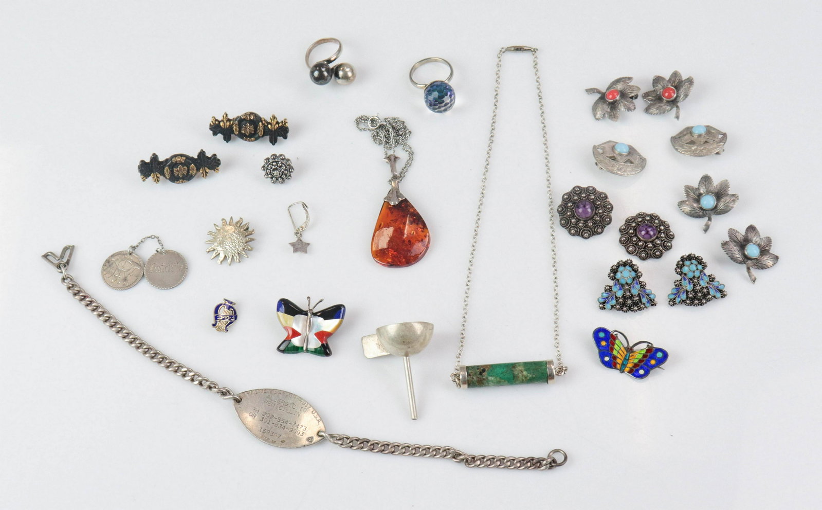 Mixed Jewelry Lot: Sterling silver and 800 silver Mixed Jewelry Lot; (1) Silver Amber Pendant, necklace 18" ; (1) 16" silver barrell stone necklace, (5) pairs of silver clip earrings, marked 800, one missing a back clip