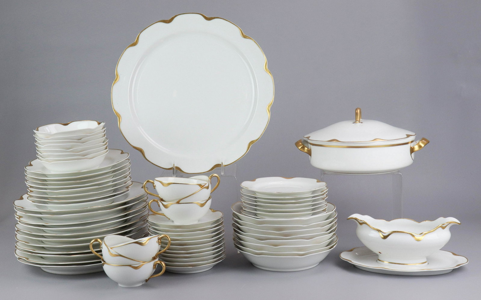 (65) Pcs Haviland Limoges Gold Rim Dinnerware: (65) Pcs Haviland Limoges gold rim dinnerware, c/o (11) 9-3/4" dinner plates (2 chipped), (8) 7-1/2" salad plates, (8) 6-1/8" B&B plates, (8) 5" fruit bowls, (8) 7-1/2" soup bowls (1 chipped), (6) tea