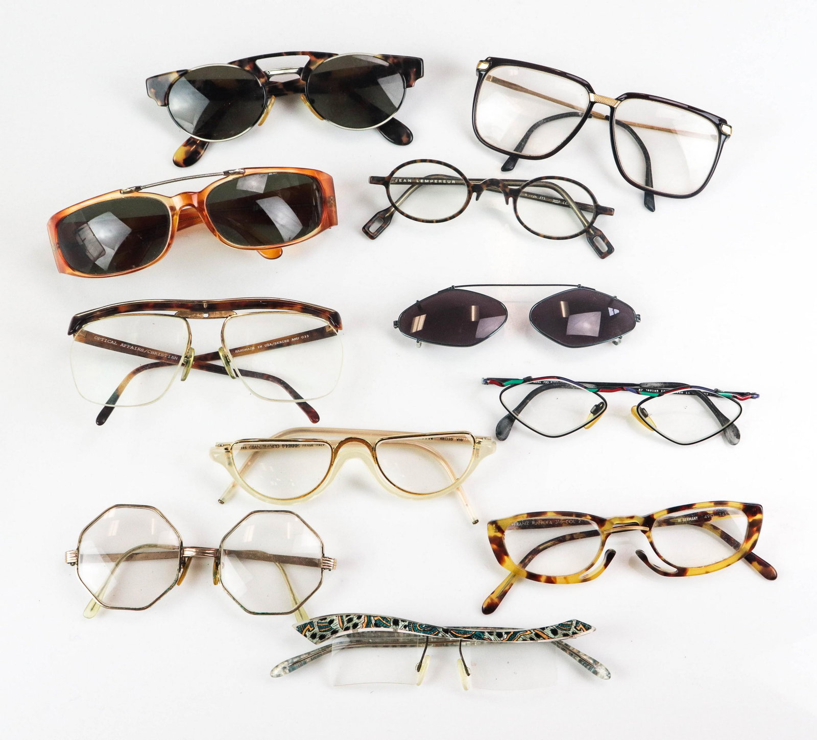 (10) Pair Designer Vintage Glasses: (10) Pair designer vintage glasses to include Optical Affairs/Christian Roth faux tortoise frames, missing piece at front, octagonal gold framed Riviera glasses, oxidation to frames, Franz Ruzicka fau