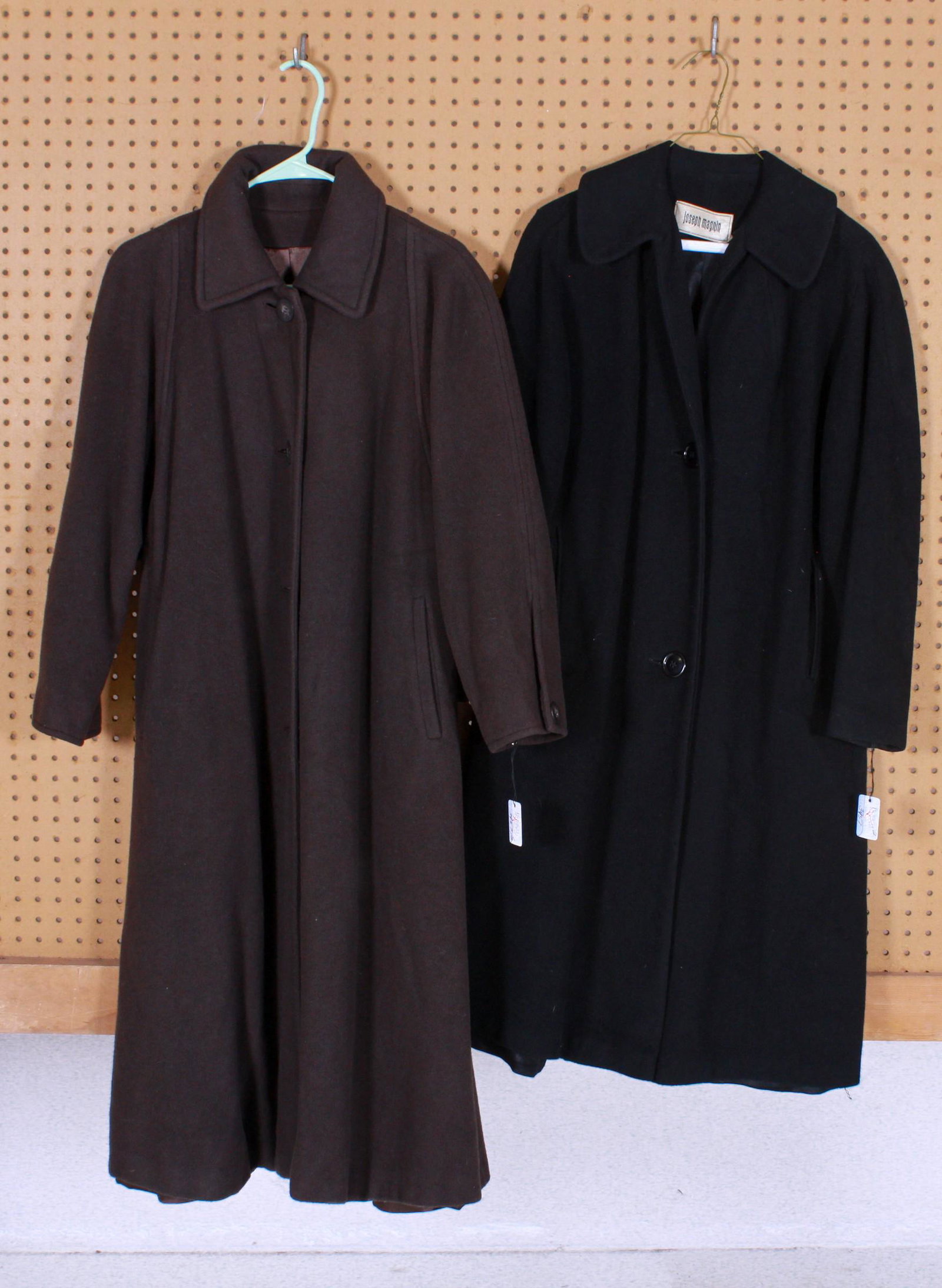 (2) Vintage Cashmere Coats: (2) Vintage cashmere coats to include Regency Cashmere chocolate brown imported cashmere silk lined coat, 30" shoulders and Joseph Magnin black cashmere coat, 30" shoulders, both M