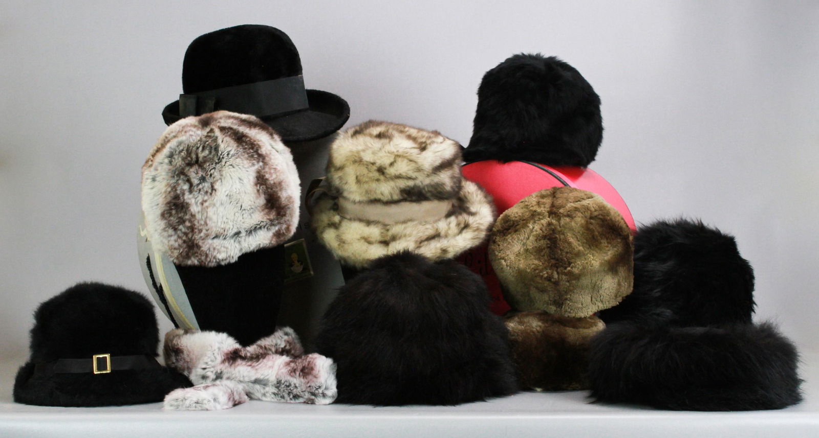 (9) Vintage Fur Hats and Muff: (9) Vintage fur hats and muff to include (2) Ann Burrows Original sheared beaver hats, Jackson and Moyer rabbit fur and cashmere hat, B. Altman and Co. Kangol 60's hat, Bonwit Teller unsheared beaver