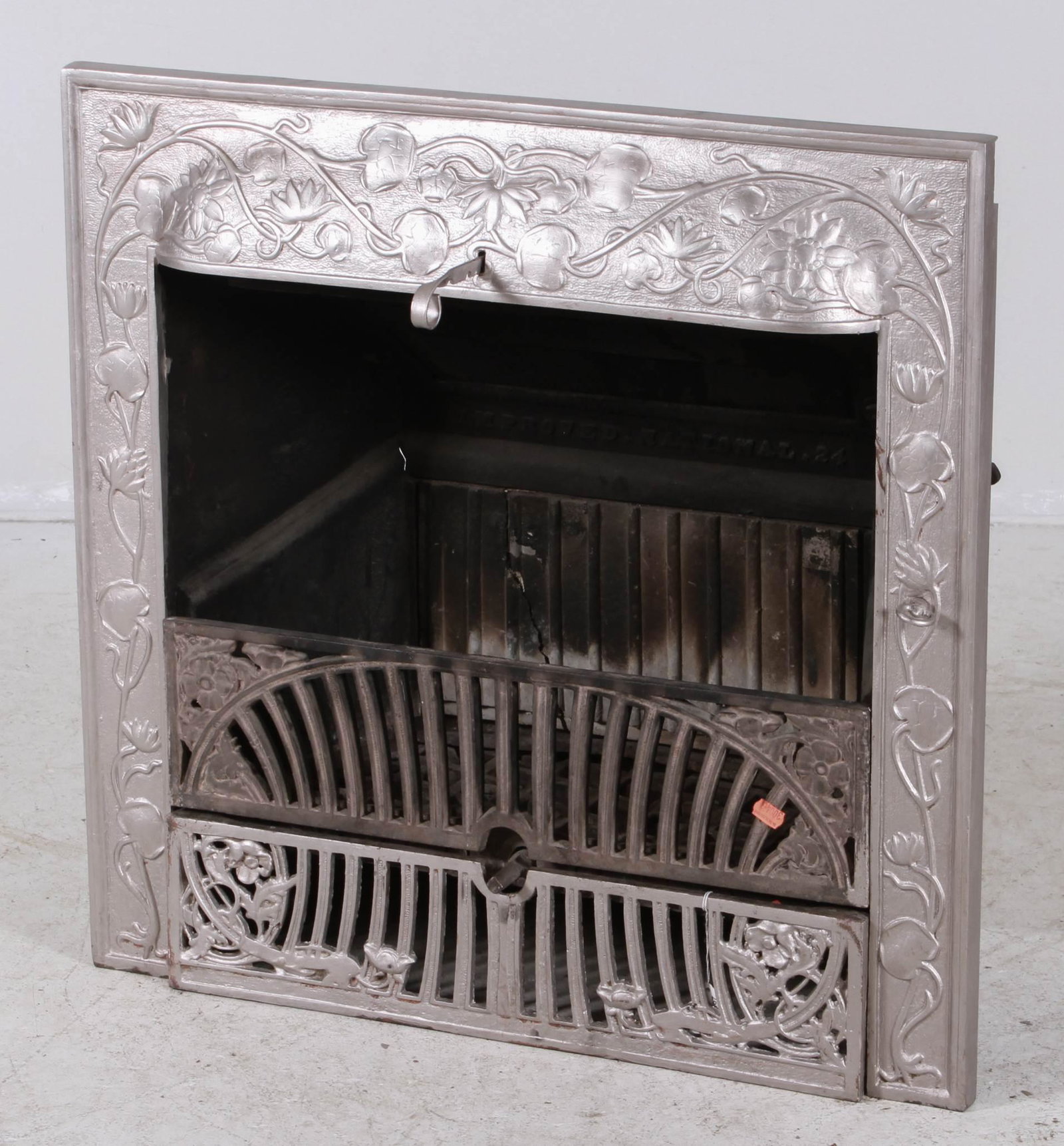 W. Sharp & Son cast iron fireplace insert: Art Nouveau design fireplace cast iron insert, W. Sharp & Son, copyrighted 1895 and dated 1902, central panel with raised markings to reverse: "D Sign Cop Righted By W. Sharp & Son 1895" and "1902", 3