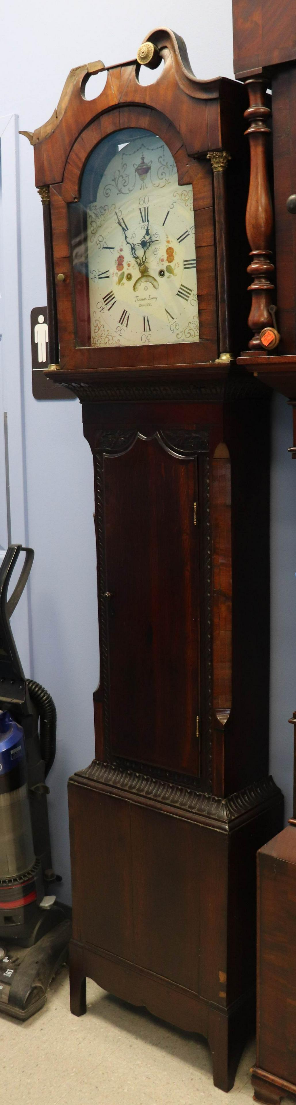 Scottish George III Oak & Banded Mahogany Tall Clock: Scottish George III Oak & Banded Mahogany Tall Case Clock, signed Thomas Ivory, Dundee, carved flowers, left bonnet scroll molding needs to be reattached, missing rosette, 86"h x 18"w x 9"d, c 1810-20