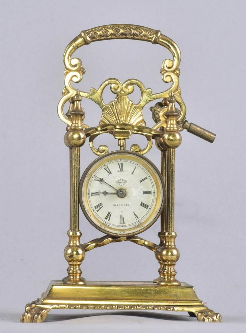 Parker Brass Portable Desk Clock: Parker brass portable desk clock, 1-3/4" dial with beveled glass crystal, footed brass frame with handle, 4-1/2" x 3-1/2" x 6-3/4" h, not currently running, key included, but does not appear to fit