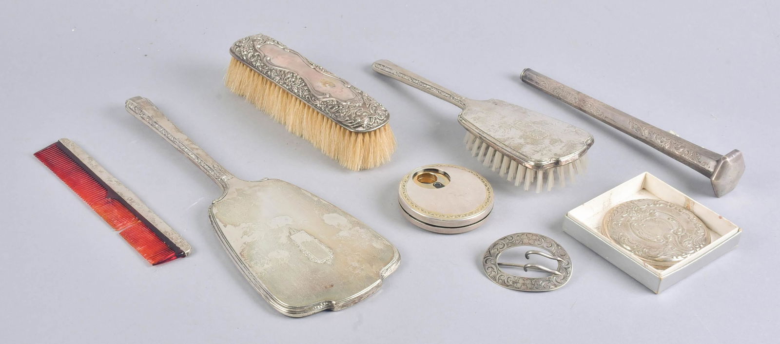 (8) Sterling Dresser Set, Mirror, Perfume, Buckle and: Sterling dresser set, mirror, perfume, buckle and handle to include sterling mounted hand mirror, brush and comb, unmatched sterling mounted repousse garment comb, Wallace sterling hand mirror, Stieff