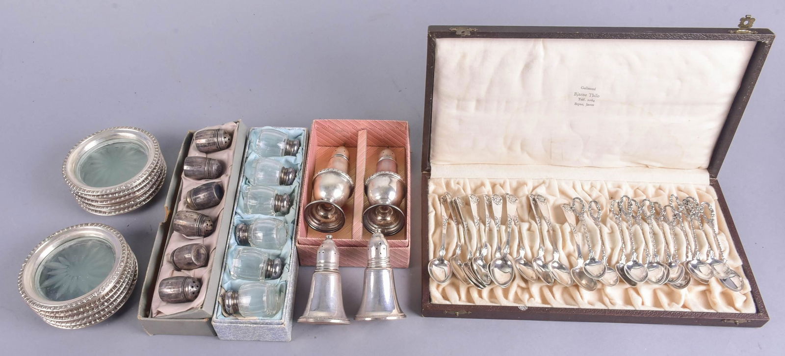 Norwegian Silver Demitasse, Coasters and Shakers: Norwegian silver demitasse, coasters and shakers to include (12) 830S silver demitasse spoons with pierced and twist formed handles, (12) 830S silver demitasse spoons with rose decorated handles, (10)