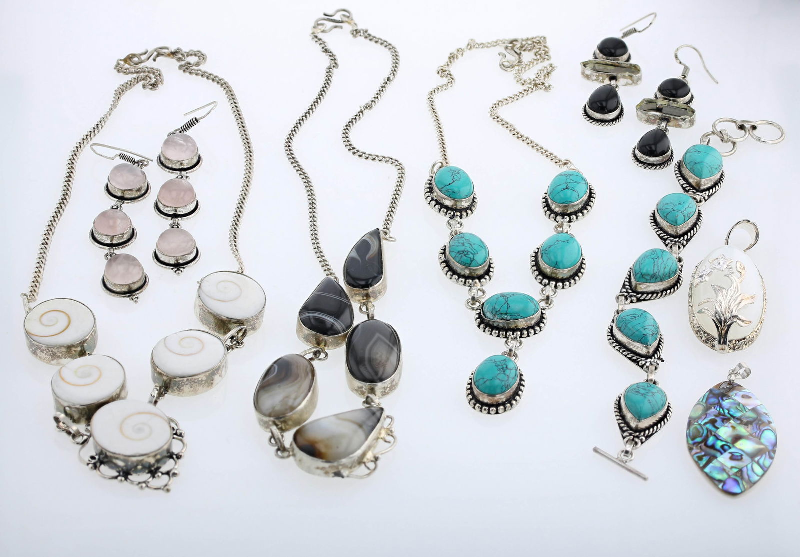 Sterling Silver Jewelry Group: (2) Bezel Set sterling silver necklaces, (1) matching bracelet (1) pair of rose quartz drop earrings, (1) silver agate necklace (broken), (1) Abalone shell pendant, unmarked, (1)black onyx drop earrin
