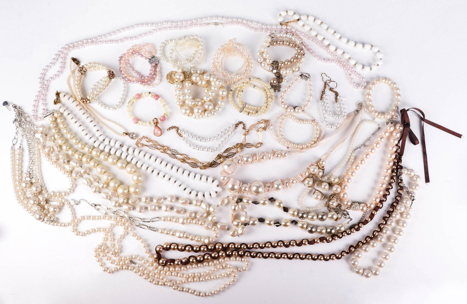 Large Lot of Pearl Fashion Jewelry: Lot of Various faux pearl bracelets and Necklaces, Lot C/O: (18) Necklaces, including a signed Talbot's Necklace. (15) bracelets All in Very good to good condition.