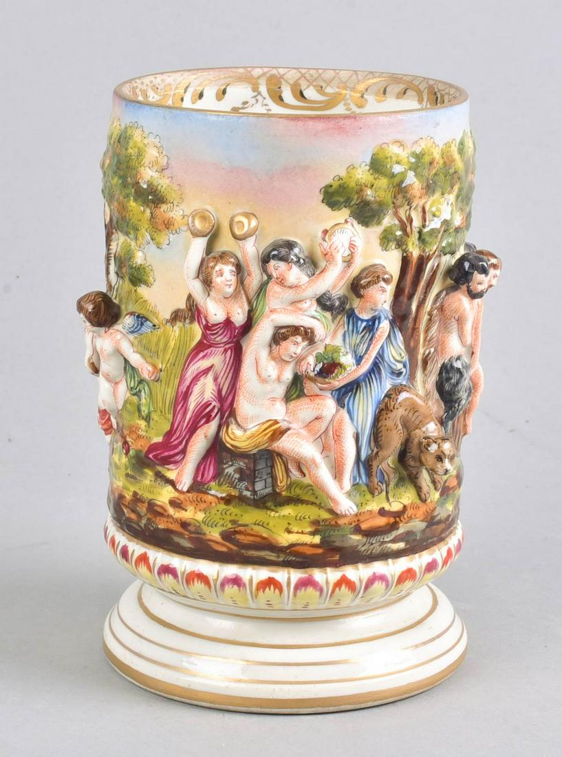 Carl Thieme Dresden Porcelain Footed Jar: Carl Thieme Dresden porcelain footed jar, in figured surround depicting scenes of cherubs, men and women gathering grapes and involved in festivities, raised relief tree forms, on footed base with par