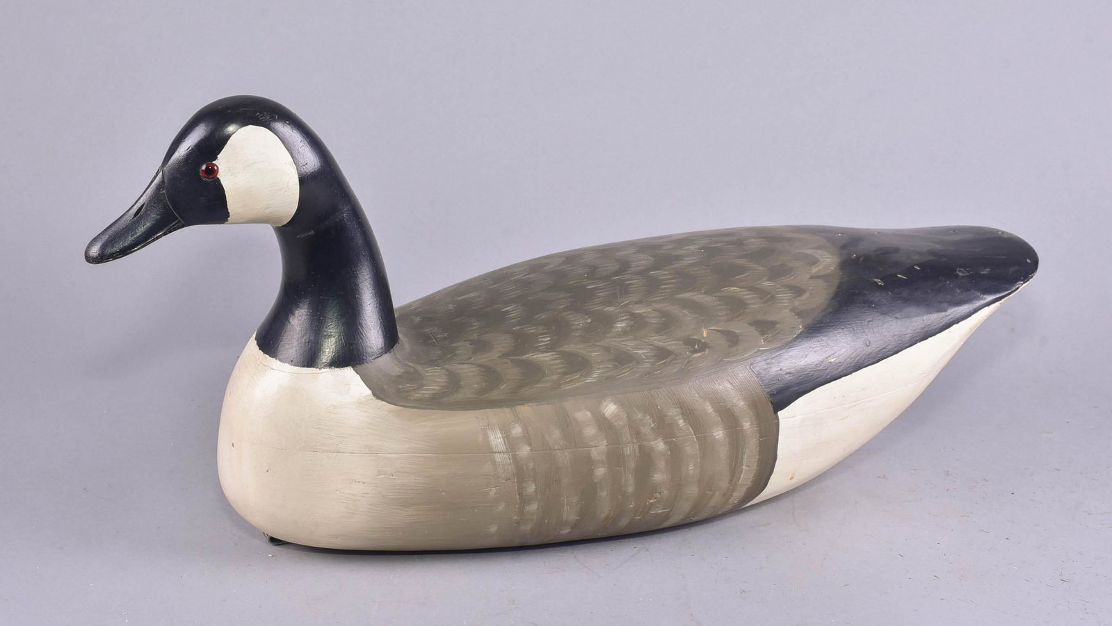 Unsigned Canada Goose Decoy: Carved & painted wood Canada goose decoy, unsigned,23-1/2" l x 10-1/2" h