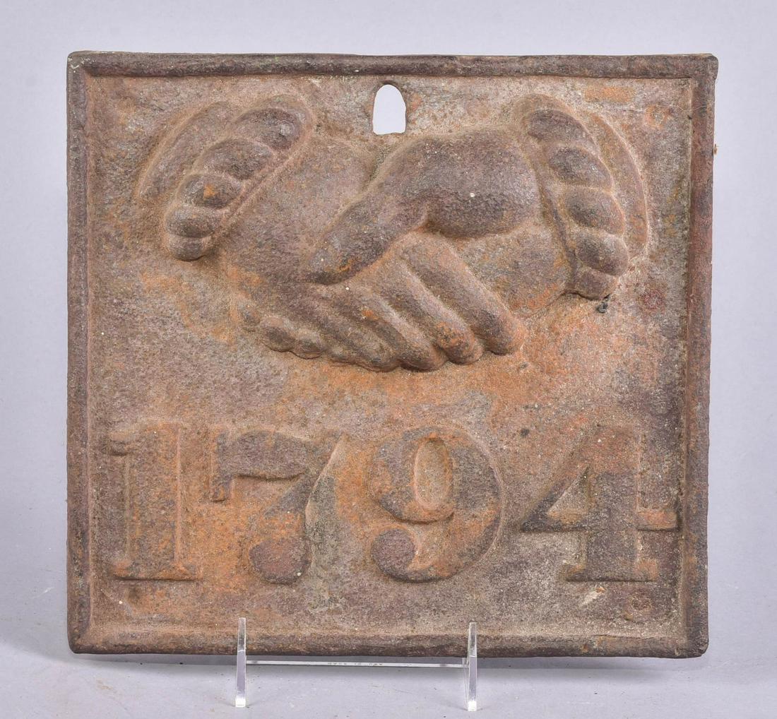 Baltimore Equitable Society Insurance Firemark: Baltimore Equitable Society Insurance firemark, cast iron plaque decorated with shaking hands and '1794', 10-1/4"x9-1/2"