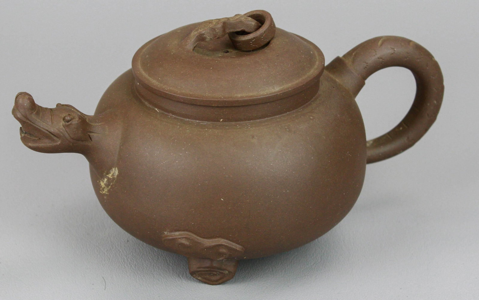 Chinese Yixing Pottery Teapot: Chinese Yixing pottery teapot, dragon spout, ring finial, impressed mark to base, 7-1/2" w x 4" h