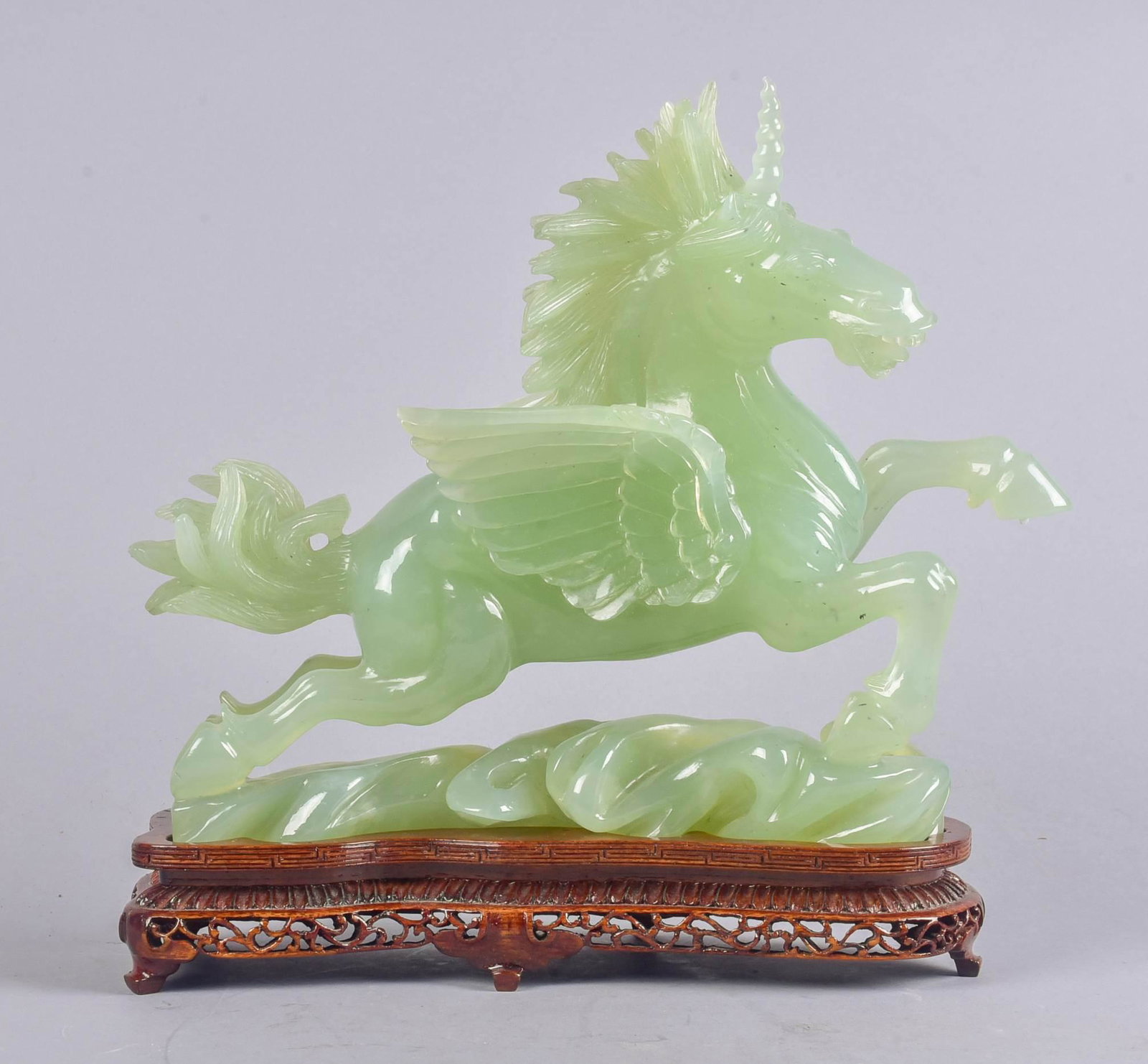 Chinese Carved Stone Unicorn Figure: Chinese carved stone winged unicorn figurine, 10" w x 10" h, with fitted carved wood stand & storage box