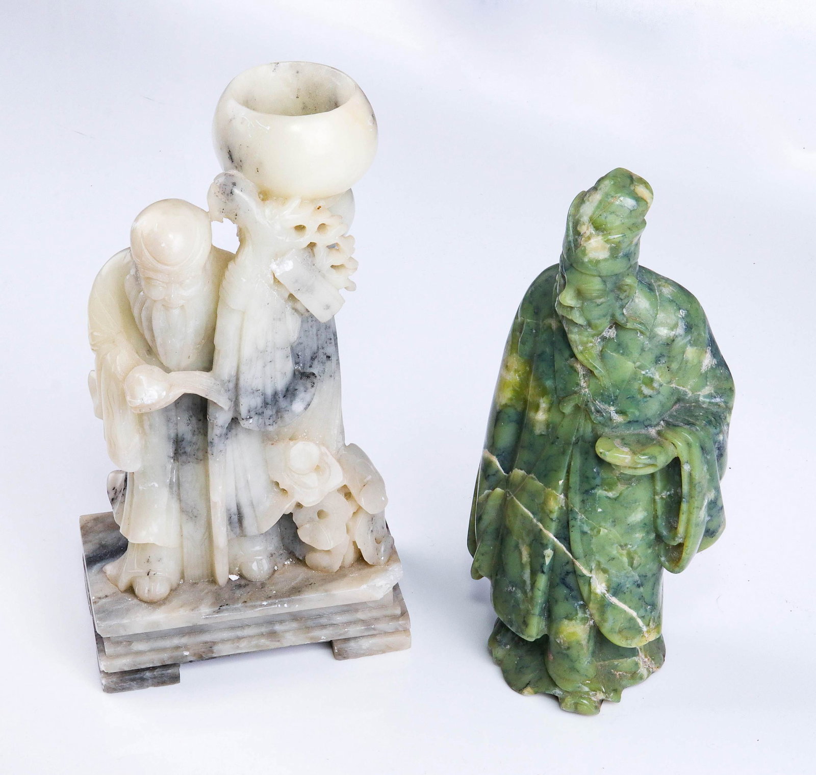 (2) Chinese Carved Shoushan Stone Figures: (2) Chinese carved Shoushan stone figures, c/o green man with dish (8" h), white man with urn (chips, drilled for lamp, 8-1/2" h)