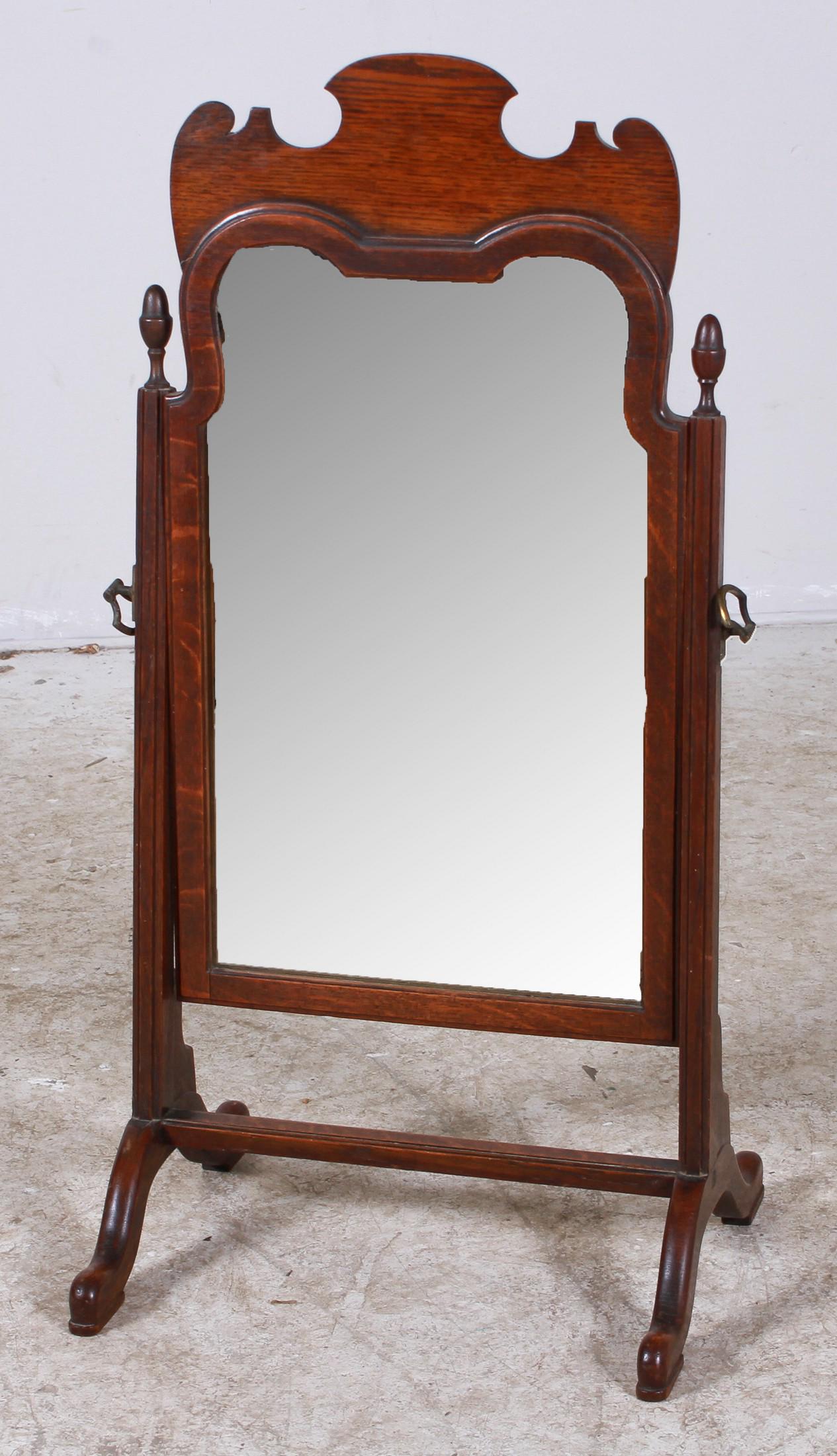 Mahogany table top dressing mirror: Mahogany table top dressing mirror, cut out crest, acorn finials, on pad feet, 33"h x 16"w