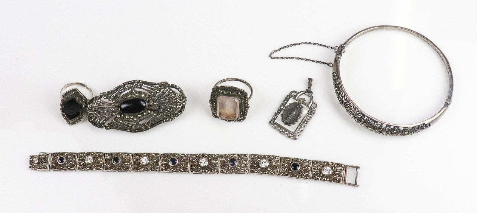 (6) Vintage Marcasite Jewelry Lot: Vintage Jewelry Lot C/O; (1) sterling silver Marcasite and Sapphire bracelet, 7.25" in length, (1) sterling silver marcasite bangle, (1) Sterling Silver onyx brooch, 57.1x29.3mm (1) Ladies art deco ma