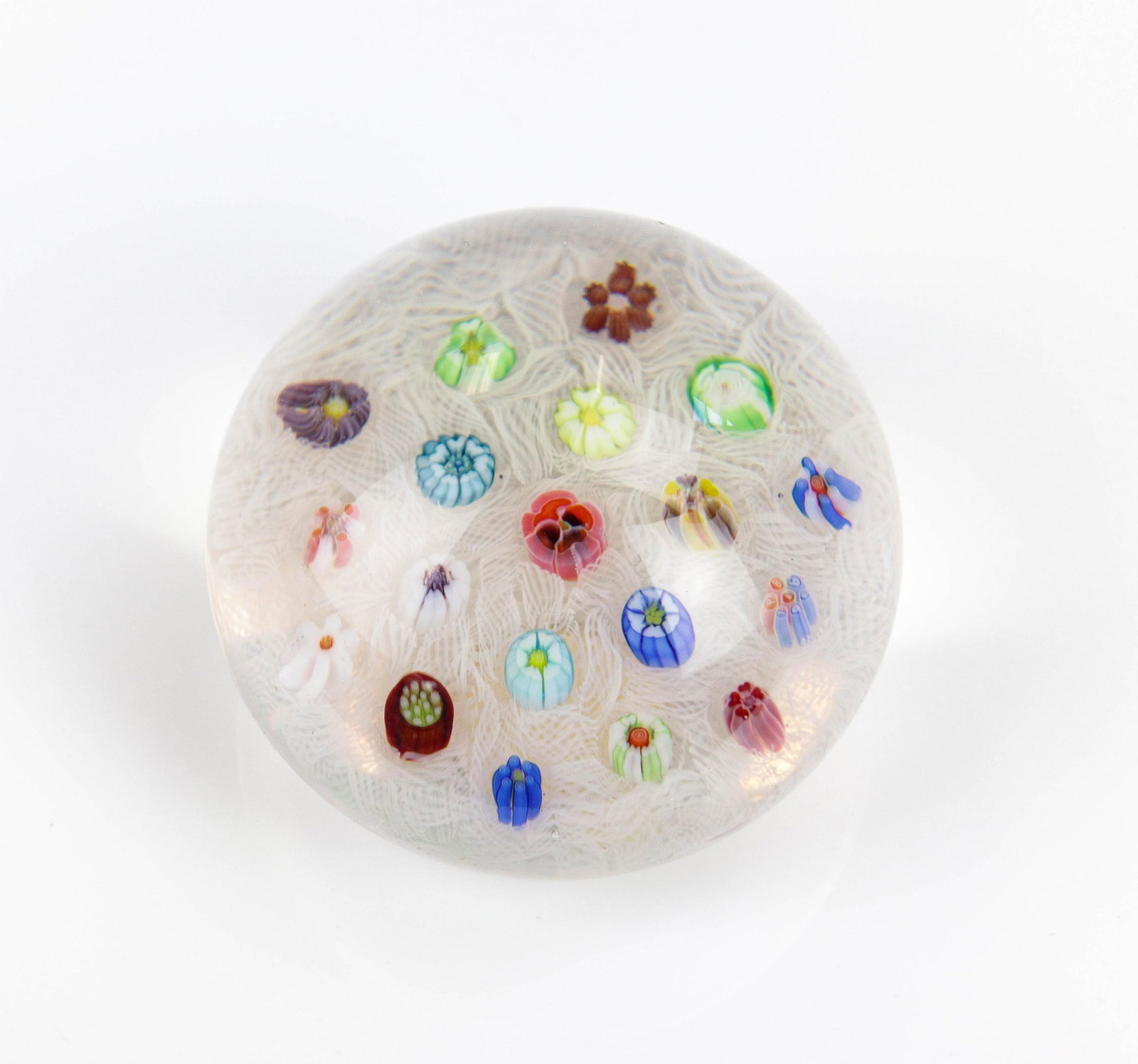 Parabelle Millefiori & Latticino Paperweight: Parabelle Glass crystal paperweight, millefiori flowers on latticino ground, foil label on base, 3" dia