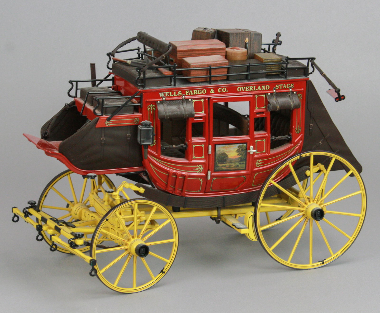 Franklin Mint 1868 Wells Fargo & Co Overland Coach: Franklin Mint 1868 Wells Fargo & Co Overland Stage Model Stagecoach, diecast construction with hand painted accents and added decals, suspension and rolling wheels including luggage, rifles and shotgu