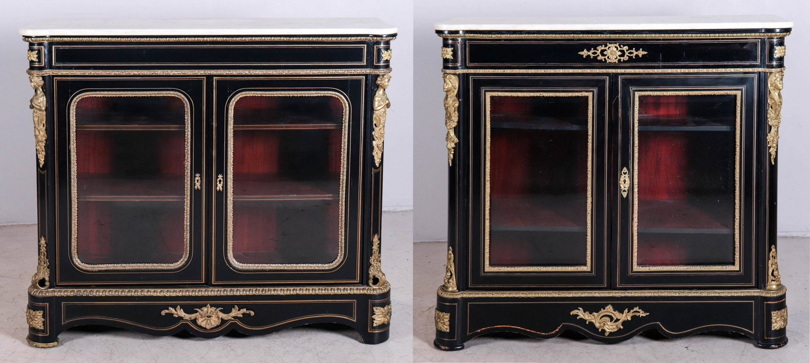 Pr Napoleon III Ebonized & Ormolu Mounted Credenzas: Pr Napoleon III Ebonized & Ormolu Mounted Credenzas, white marble tops, ladies heads at tops of corners, ormolu trim throughout, 2 beveled glass doors, beveled glass ends, 2nd 1/2 19th c, 48" w, 43" h