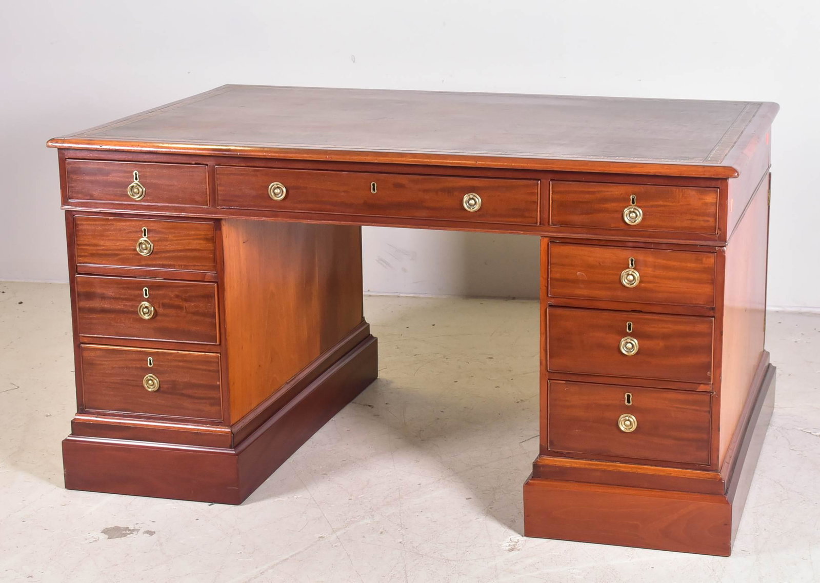 Mahogany English leather top partners desk: Mahogany English leather top partners desk, brown leather top with decorative border, single drawer flanked by 4 drawers on each side, comes in three pieces, 33"h x 60'w x 38"d