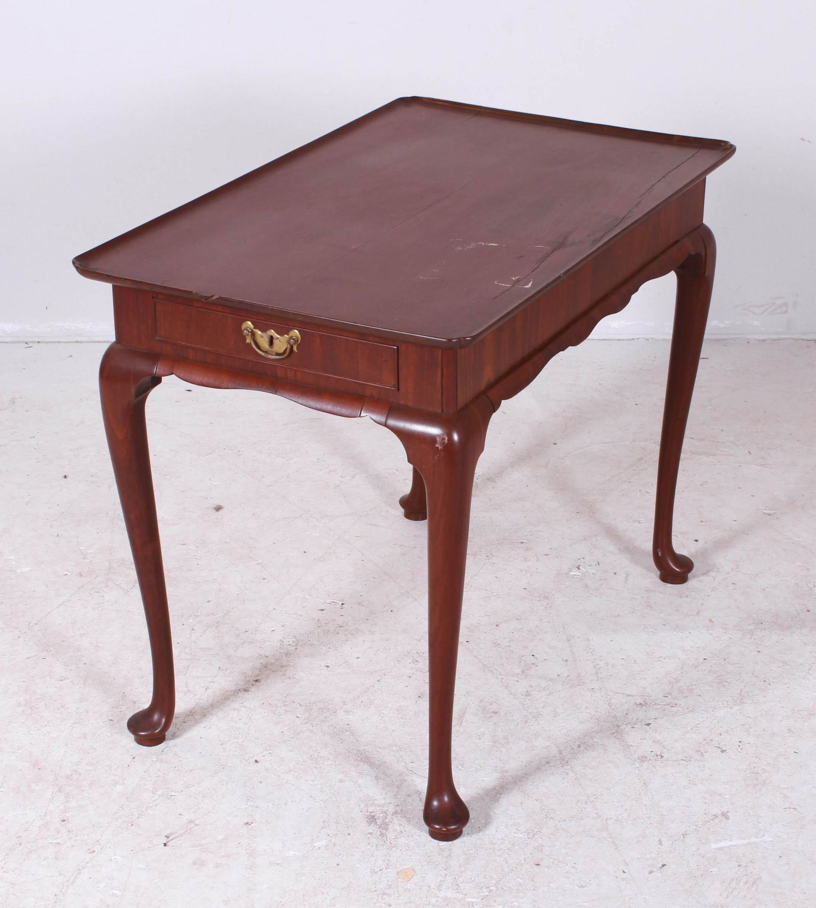 Mahogany QA tray top tea table, English, mid 18th c: Mahogany QA tray top tea table, drawers at either end, scalloped skirt, 28-1/2"h x 36"w x 22-1/4"d, English, mid 18th c, small split in top, repairs to skirt, one piece missing by drawer