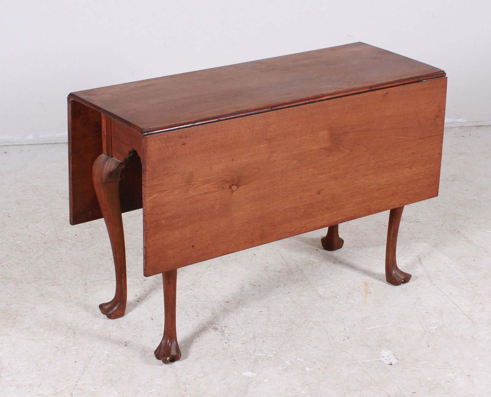 QA walnut drop leaf table: QA walnut drop leaf table, cabriole legs with pad feet, 28"h x 42"w x 16"d, two 15-1/4"w leaves