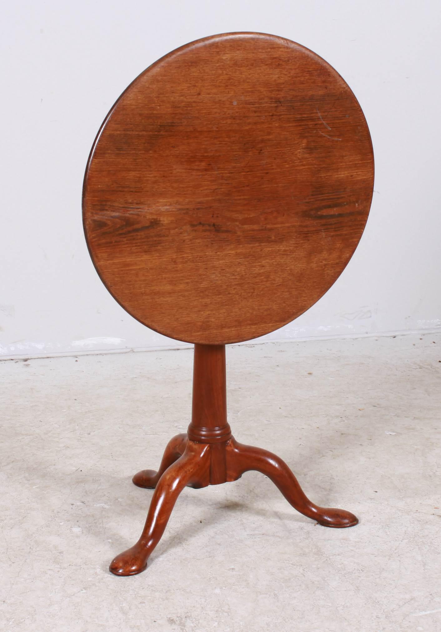 George III Mahogany tilt top tea table with birdcage: George III Mahogany tilt top tea table with birdcage, trifid arched scroll legs ending in pad feet, late 18th c, 29"h x 27"diameter