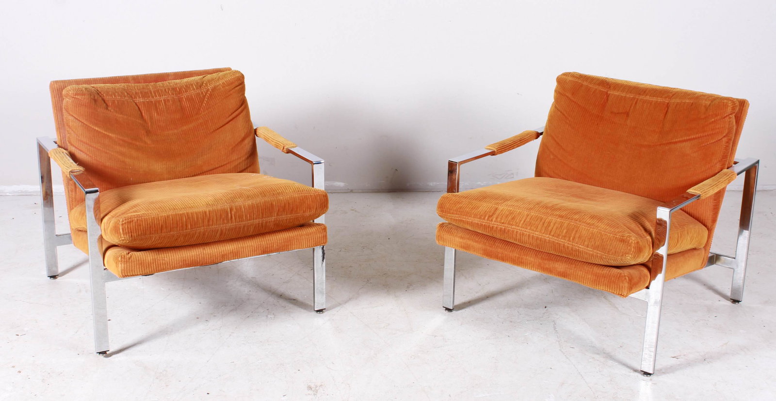 Pair Milo Baughman for Thayer Coggin lounge chairs: Pair Milo Baughman for Thayer Coggin lounge chairs, chrome frame with orange corduroy upholstery, 28"h x 28-1/2"w x 31"d, one arm upholstery with damage