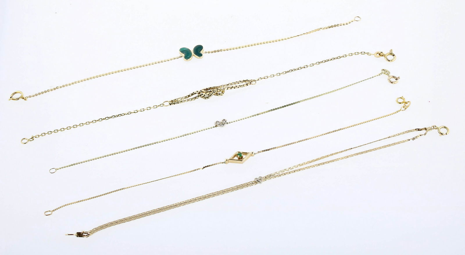 (5) Delicate Chain Bracelets: (5) Delicate Contemporary Bracelets lot C/O; (1) double chain heart bracelet, spring clasp, Small accent diamond, (1) love knot gold bracelet, (1) s link chain with heart focal, set with small accent