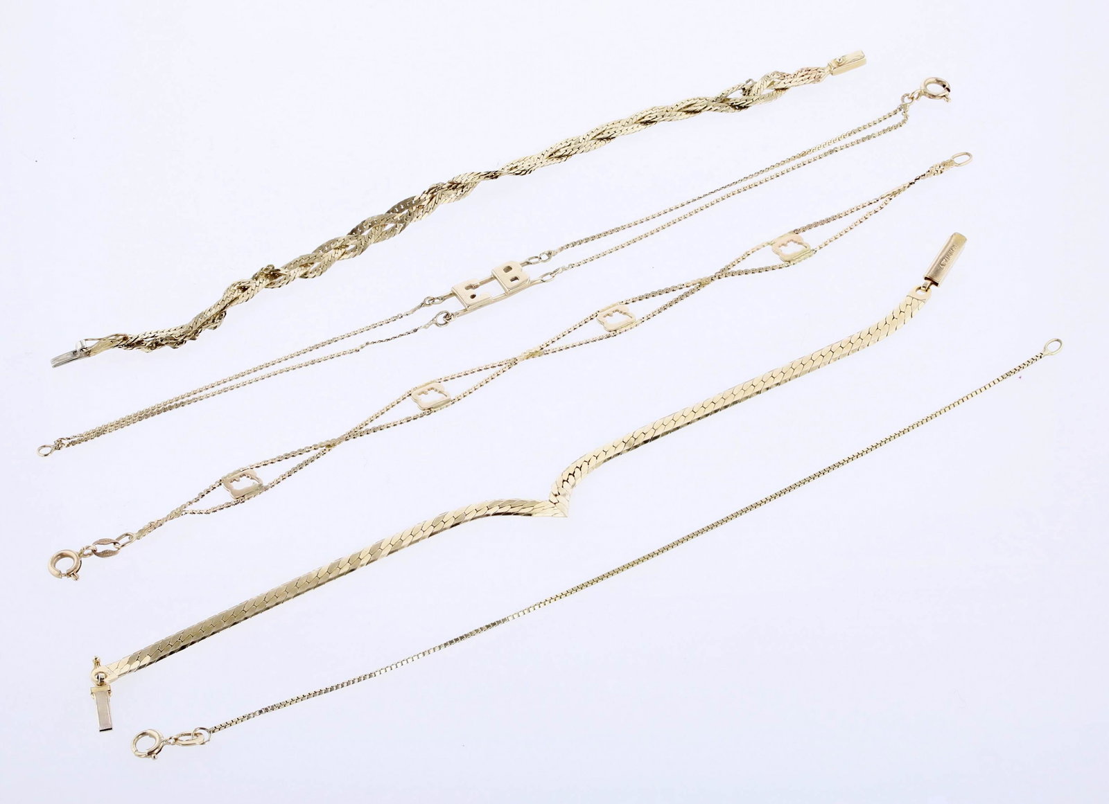 (5) 14K Chain Bracelets: (5) Chain bracelets, (1) braided 14K for repair or scrap, (1) 14K Italian gold V shape herringbone bracelet, (1) box link chain bracelet, (1) double chain elephant cut out bracelet, (1) "EB" initial b