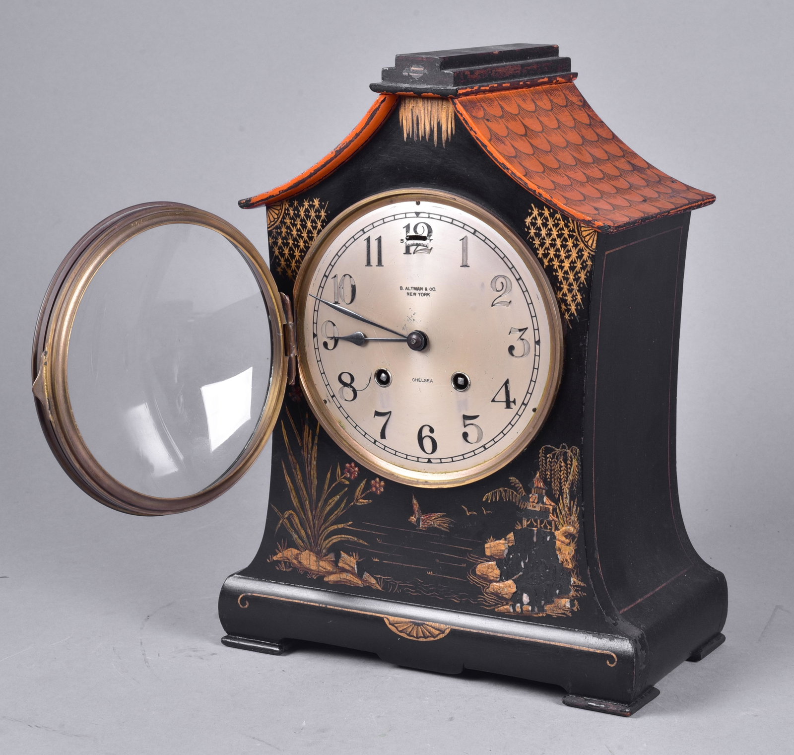 Chelsea Pagoda Form Mantle Clock: Chelsea Pagoda Form Mantle Clock, gilt and black lacquered decoration, silvered dial marked B Altman & Co, NY, Chelsea, 8 day time and strike cylindrical movement, 12" high, not currently running
