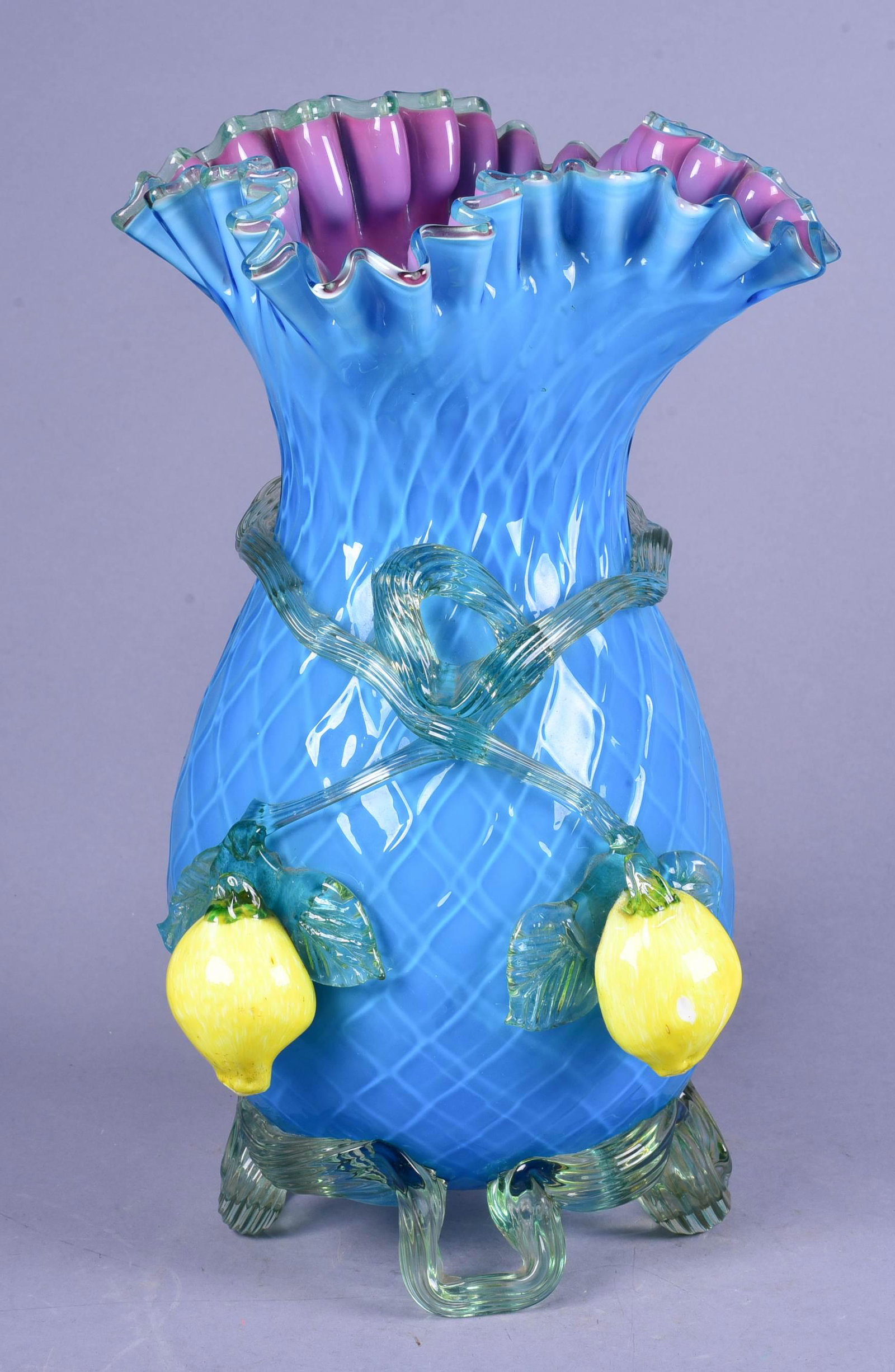 Victorian Diamond Quilted Art Glass Vase: Victorian Diamond quilted art glass vase, cerulean bodied with dark lavender interior applied bright lemons and vines, ruffled edge, 12"H