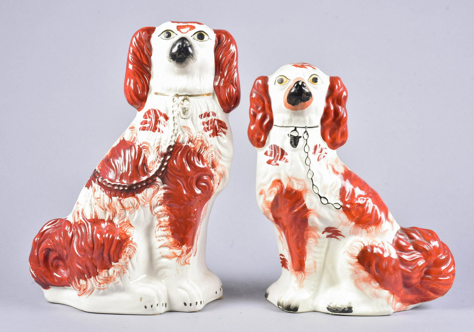 Near Pair Staffordshire Dogs: Near pair Staffordshire dogs, 12-1/2" and 14-1/2" h, unmarked at underside.
