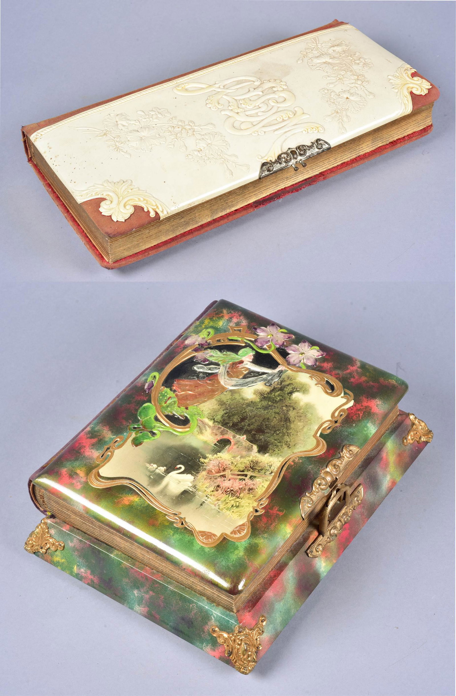 (2) Celluloid Photo Albums: (2) Celluloid photo albums to include embossed oversized photo album, 51 portraits at interior, very good condition, 16"L and Nouveau music box album with swan scene at top, (1) childs portrait at int