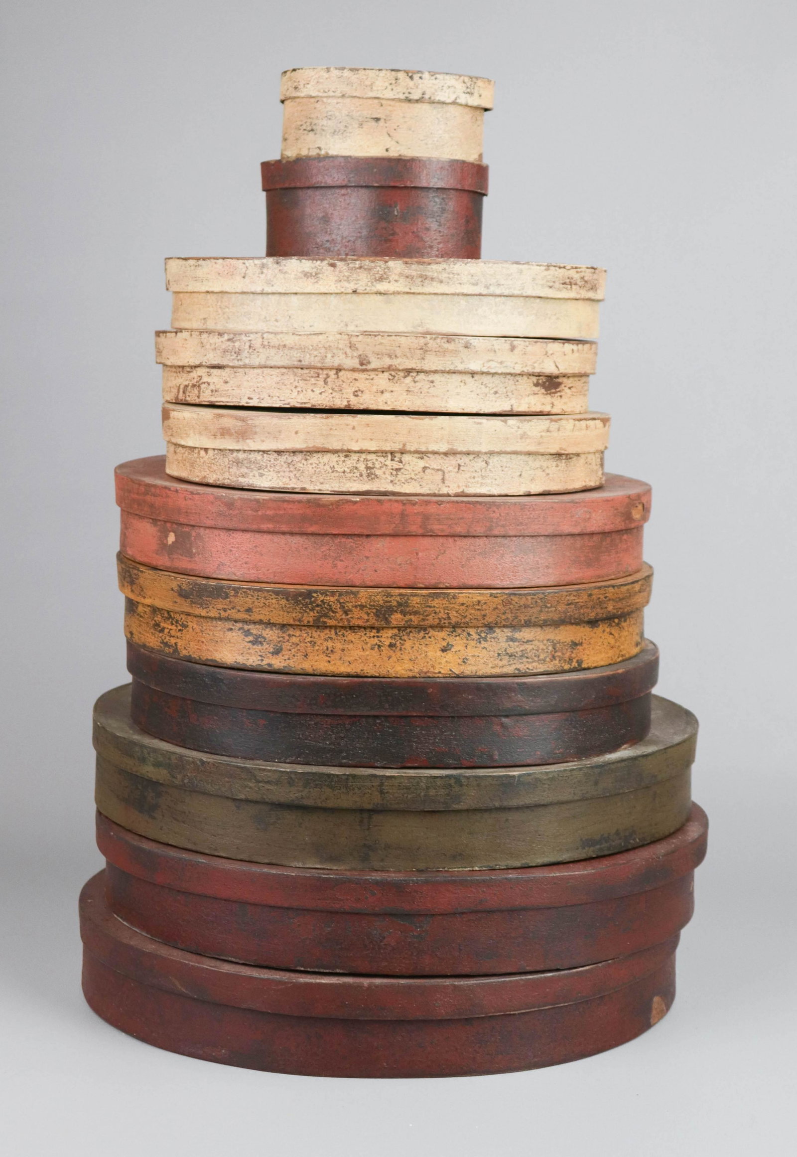 (11) Reproduction Stacked Pantry Boxes: (11) Reproduction stacked pantry boxes, cardboard construction to include (2) at 14-1/4" L x10-3/4"W, (1) at 14"x10-3/4"W, (3) at 12-1/4"Lx9-1/4"W, (3) at 10-1/4" Lx7-1/2"W, (1) at 5-1/4"Lx3-3/4"W and