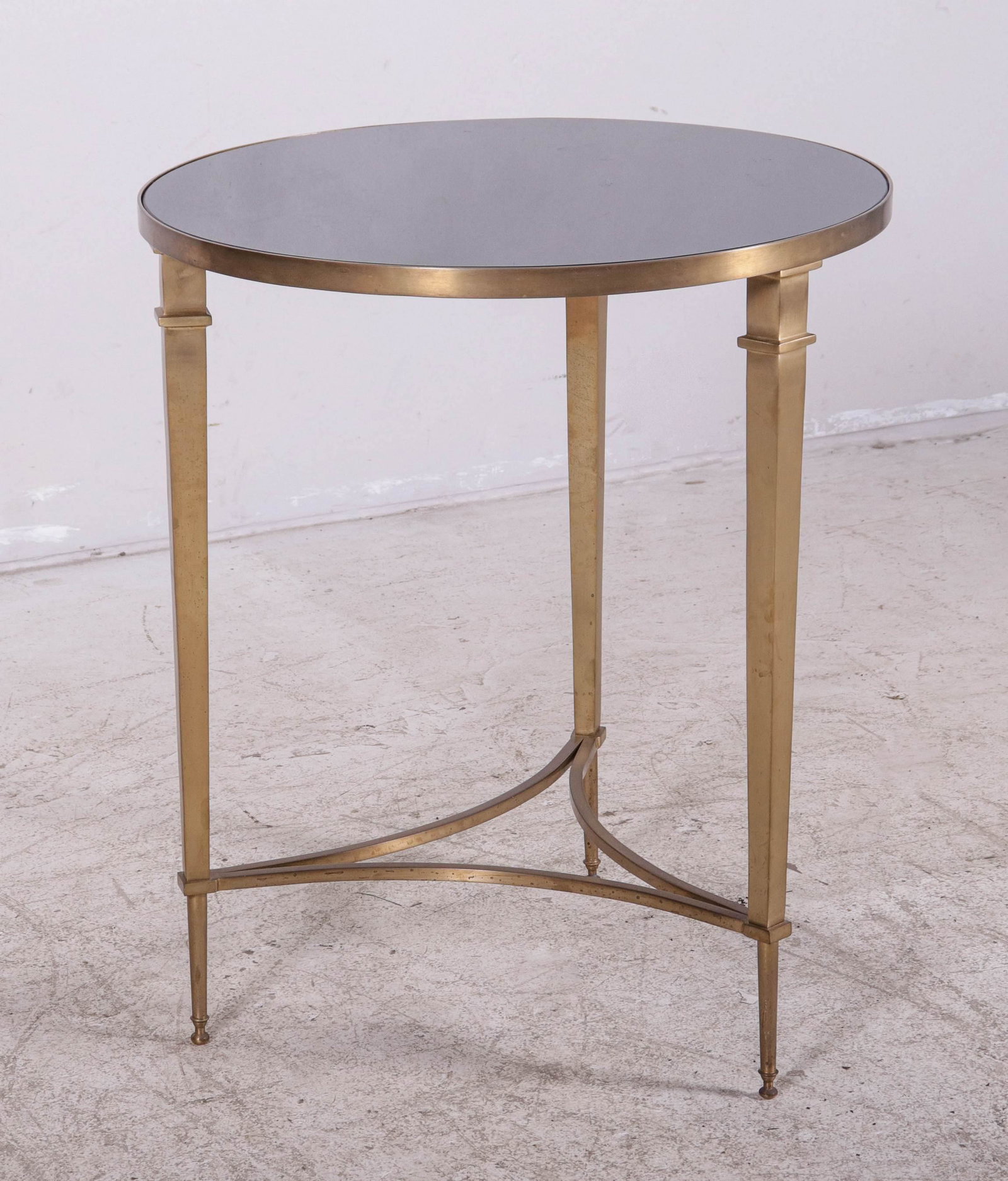 Directoire style brass and marble gueridon: Directoire style brass and marble gueridon, round marble insert, brass stretcher base, 26"h x 21-1/2"diameter