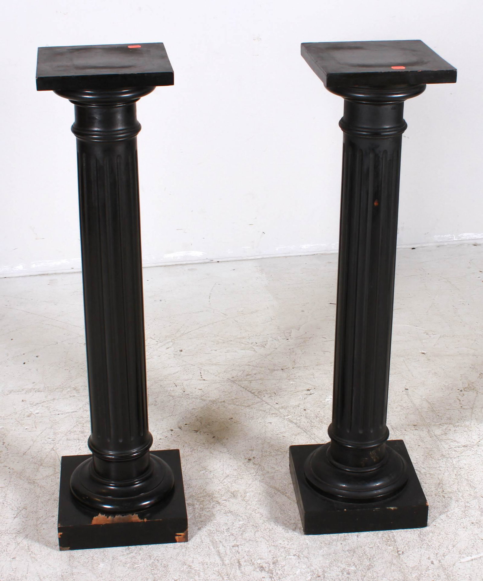 Pair ebonized wood carved columned pedestals: Pair ebonized wood carved columned pedestals, 42"h x 10"square, wear to paint