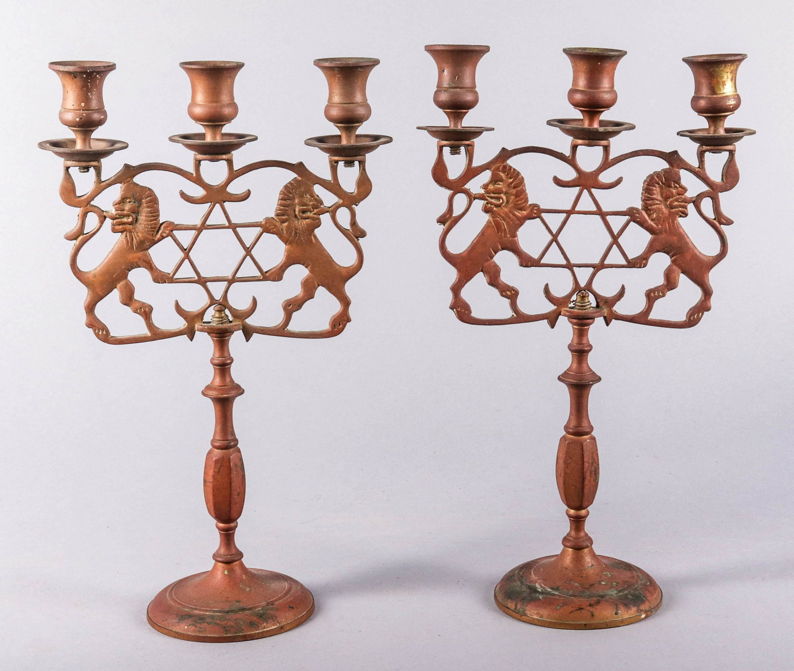 Pair of Judaica Sabbath Candelabra: Pair of bronze Judaica Sabbath candelabra, 3- light, rampant lions & Star of David, 14" h x 8-1/2" w