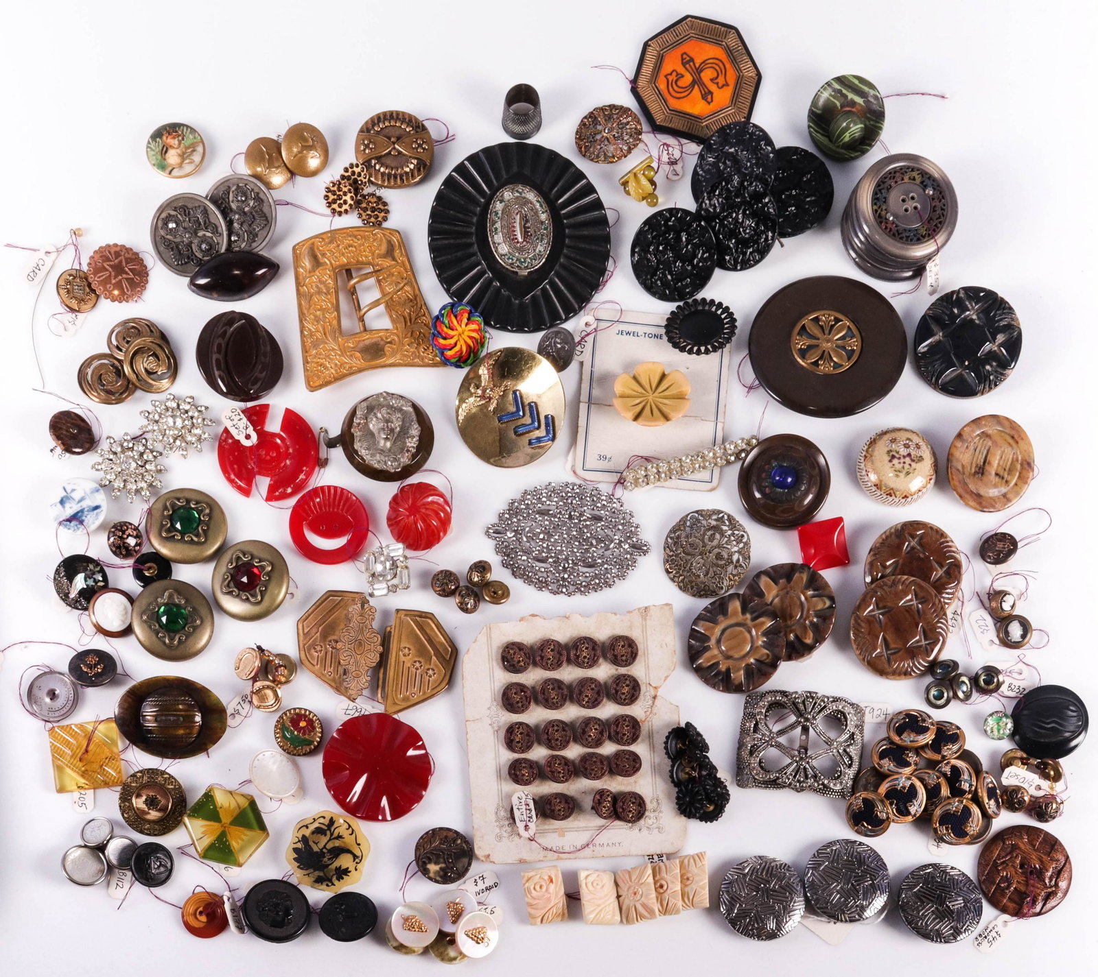 19th/20th c. Buttons and Buckles: 19th/20th c. buttons and buckles to include bakelite, glass, steel cut, bone, MOP and gutta percha buttons, also to include steel cut openwork shoe buckle and repousse gilt Nouveau shoe or belt buckle