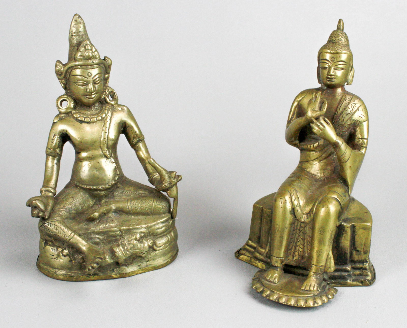 (2) Seated Bronze Buddha Figures: (2) Seated bronze Buddha figures to include Jambhala and Maitreya, both resealed at underside, 20th c., 7" h