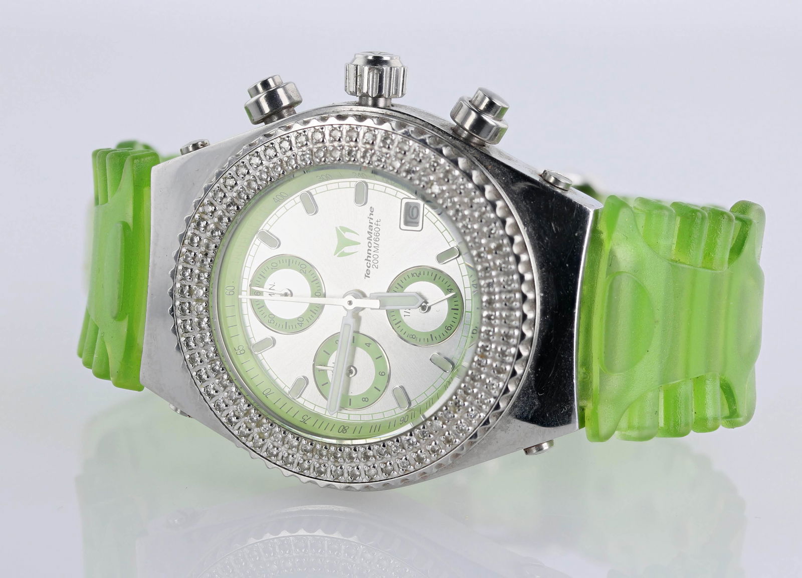 Men's TechnoMarine Diamond Watch: A Men's TechnoMarine Watch, green band, 1.0mm accent diamonds on the bezel. it comes with a case pouch and additional bands/straps.