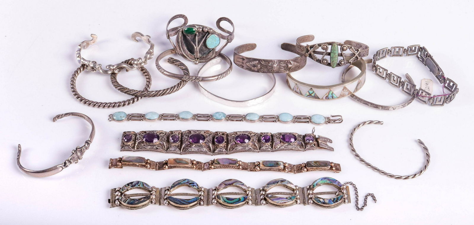 Silver Bracelets and Bangles: Silver Bracelets and Bangles, Silver (3) link bracelets,one set with Larimar stones (10) southwestern silver cuffs, (1) delia pina .9699 silver cuff hammered textured finish. (2) Alpaca shell inlay br