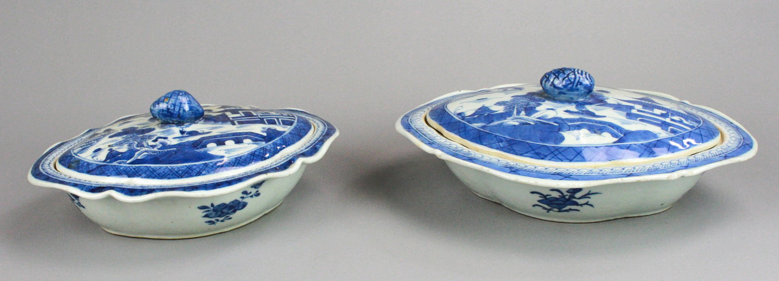 (2) Chinese Canton Oval Covered Casseroles: (2) Chinese Canton porcelain oval covered casseroles, pinecone finial, unmarked, c/o 11-1/4" x 9-1/4" x 4-1/2" h (roughness around edges), 9-3/4" x 8" x 4-1/2" h (chip to rim)