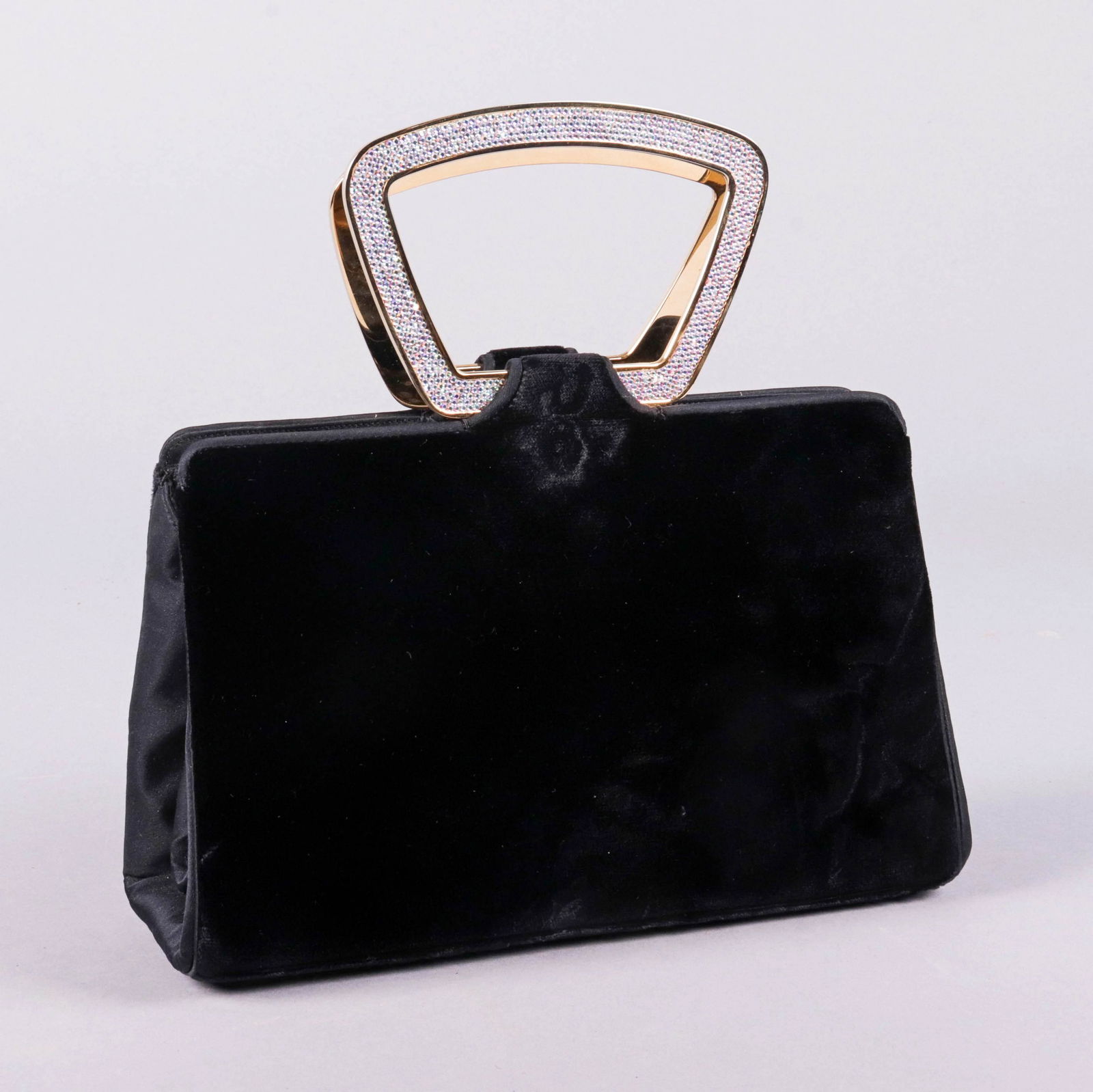 Judith Leiber Black Velvet and Crystal Purse: Judith Leiber black velvet and crystal purse, dual compartment sides, pinch closure center compartment, coin purse, gold tone matched comb and mirror, with gold tone crystal set double handles, with o