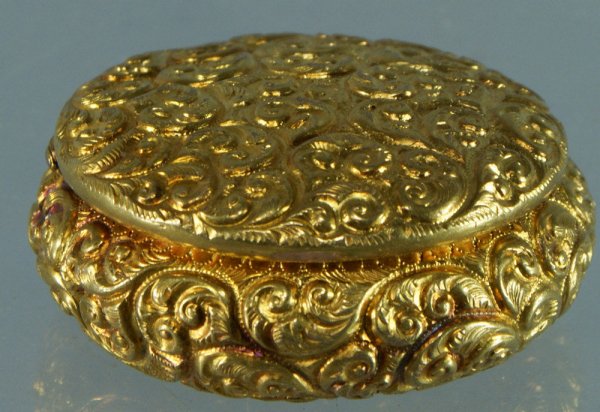 YG repousse pill box, c-scroll designs, unmarked, t: YG repousse pill box, c-scroll designs, unmarked, tests as gold on stone, probably 14K, 1 3/4" d, 12.7 dwt