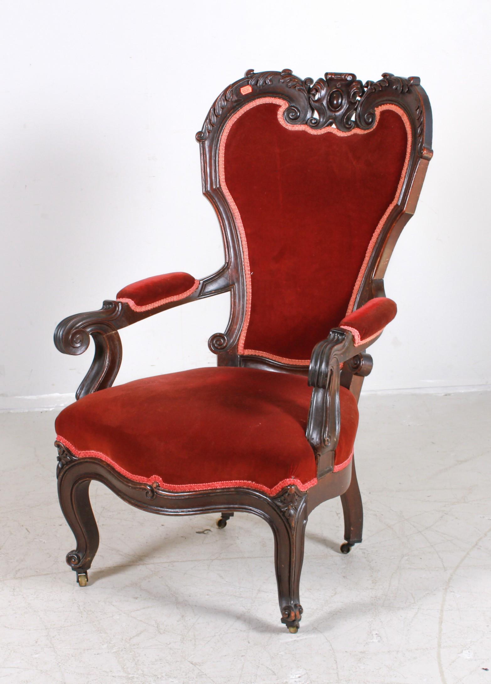 Victorian carved walnut Man's open chair: Victorian carved walnut Man's open chair, red velvet upholstery, scrolled and acanthus decorated crest, 44"h x 27"w x 23"d, repaired right arm, repaired corners at crest